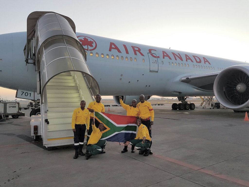 South African firefighters before boarding Air Canada plane to Fort McMurray, Alberta